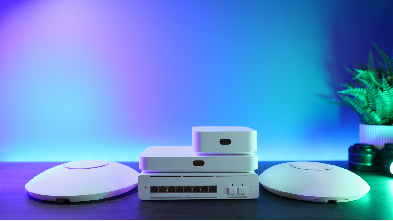 UniFi Pro XG 8 PoE switch with two UniFi gateways stacked on top, between two access points